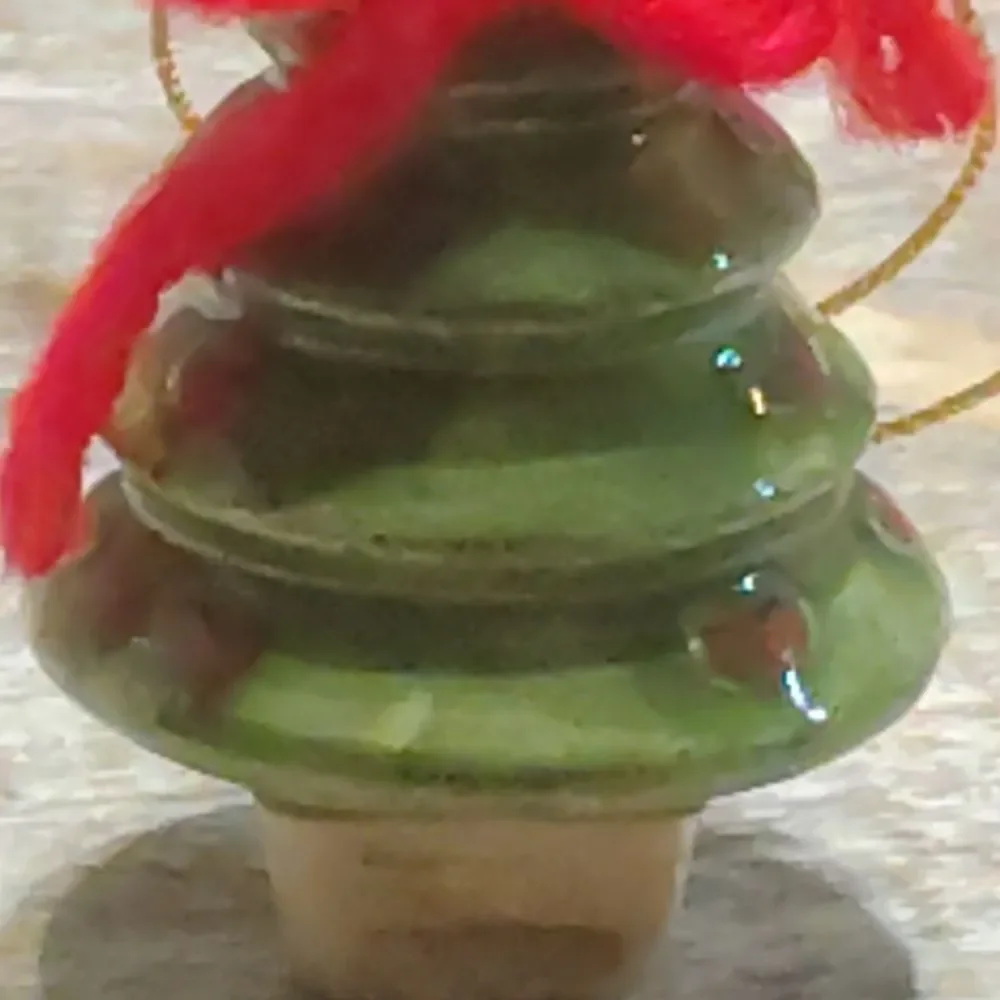 Festive Green Christmas Tree Ornament with Red Accents